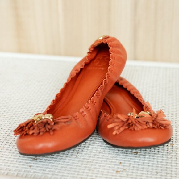 Tory Burch | Reese Orange Mestico Tassel Flats - Picture 1 of 2